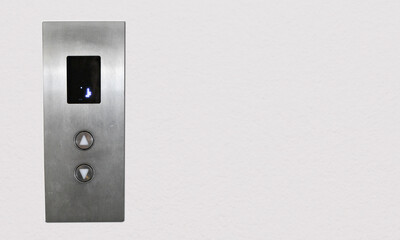 Elevator call button on wall with free space for creative concept.