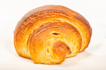 Fresh baked homemade plain butter croissant with a beautiful open honeycomb.