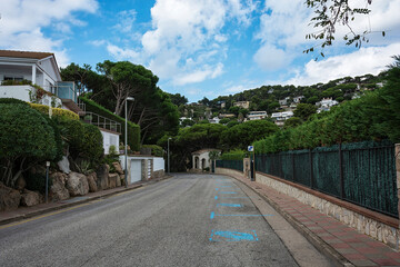 City street with road markings «Paid parking» (Blanes, Spain)