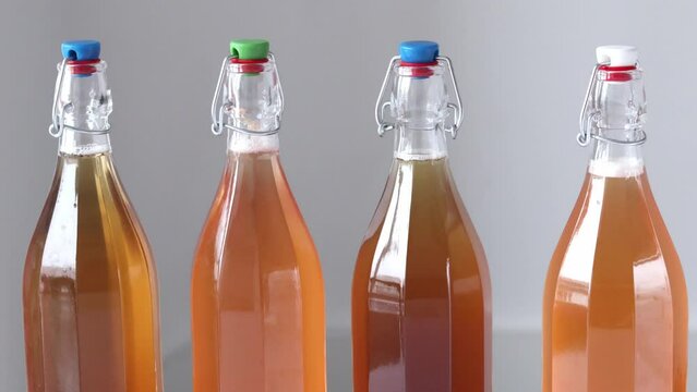 Homemade fermented tea mushroom kombucha drink in bottles. Probiotic, symbiotic superfoods. Non-alcoholic fizzy cocktail, antioxidant.