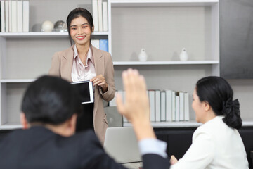 Collaborative process of professional businesspeople going over on new project together, using tablet presentation and brainstorming ideas, coworker and working together at office meeting concept