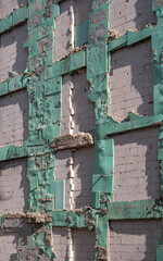 insulation works on the exterior of the building. damaged wall.
