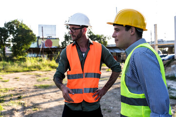 Two Engineer Construction men working in construction site