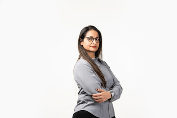 Happy successful Indian woman standing in casual outfit, confident, smiling pleased at camera