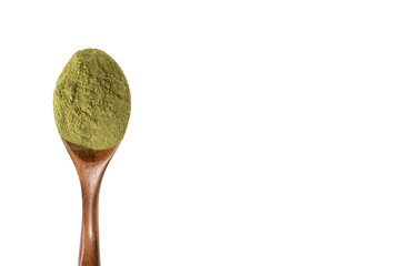 Green powder in a wooden spoon on isolated transparent background. Dried organic wheatgrass. Copy...