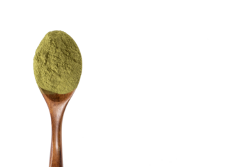 Green powder in a wooden spoon on isolated transparent background. Dried organic wheatgrass. Copy space, png
