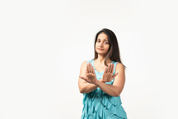 Indian woman isolated on white background rejecting someone showing a gesture of disgust.