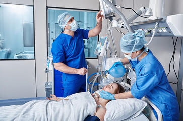 Nurse and doctor using medical ventilator on female patient while cardiopulmonary resuscitation in ICU and monitoring health. CPR in ICU - 571820003