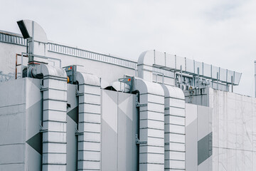 Rooftop air vent ways flow ventilator system. air conditioner pipe line in large mall building city...