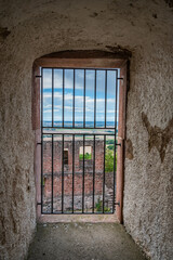 View from observation tower at castle veste otzberg, old wall with window and lattice window, odenwald, germany