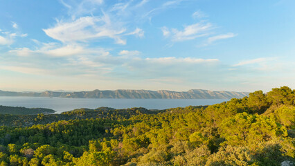 Obraz premium View of the beautiful forested Island of Mljet, a national park in Croatia with the peninsula Peljesac in the background