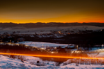 Winter golden sunset light in the sky. Long exposure