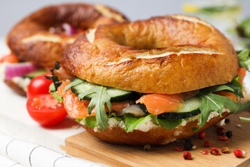 Concept of delicious food - tasty bagel sandwich