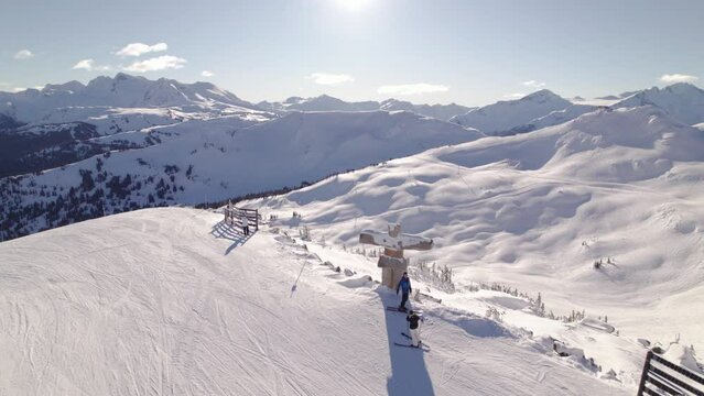 Aerial drone footage of Whistler mountain, mountain vista, BC, ski hill on a sunny day. 4K DCI 24FPS