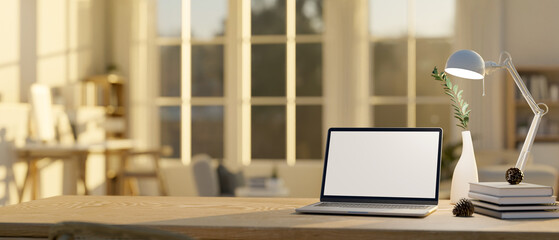 Close-up image of a laptop mockup, decor and copy space on wood tabletop