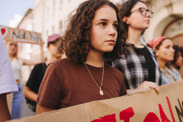 Diverse young people protesting against war - obrazy, fototapety, plakaty