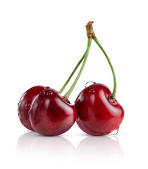 Three sweet cherries with green stem isolated on white background with clipping path.