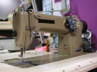 Close up of a sewing machine in a dressmaker workshop