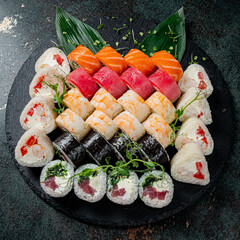tasty sushi on the wooden background