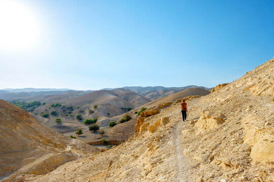 Hiker in Wadi Quelt, Prat River gorge, Jericho, West Bank, Palestine