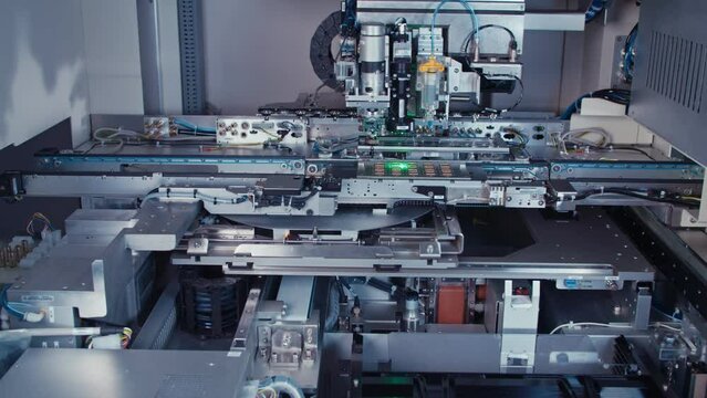 Automated SMT machine placing electronic components on a board