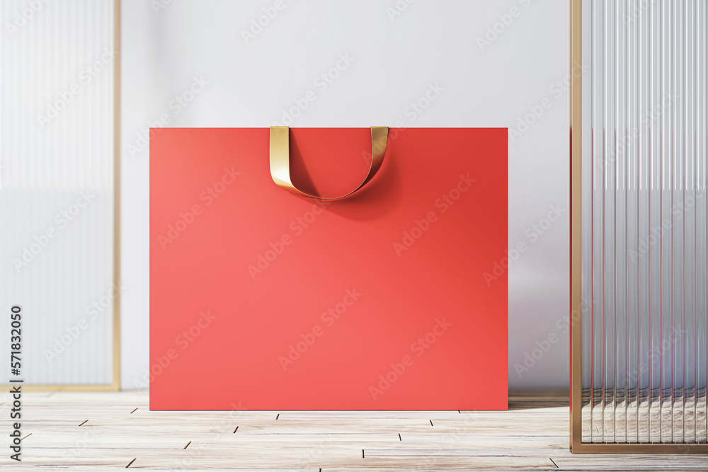 Poster Front view on blank red paper shopping bag with place for your brand name or text on light wooden floor and light wall background, closeup. 3D rendering, mock up