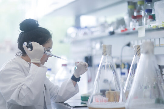 young scientist female with tablet in a laboratory