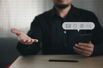 Businessman pressing telephone, Contact us or Customer support hotline people connect. Businessman using smart phone and touching on virtual screen contact icons 