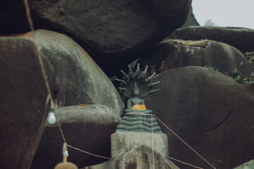 Budha golden you from nature stone ancient ancient times cliping part
