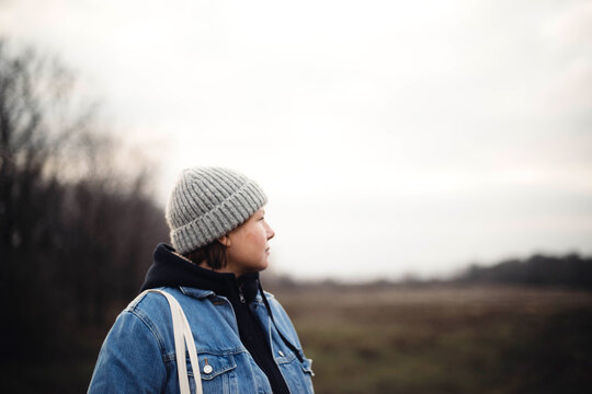 Portrait of a 40 years old woman in a hat outdoors