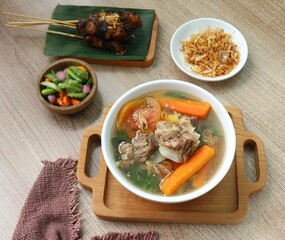 a bowl of beef rib soup with carrots