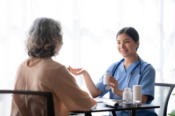 Asian female doctor explaining treatment and taking medicine.