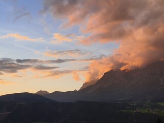 Beautiful colorful sunset over the mountains in Schladming with view to distinctive famous Dachstein mountain in Styria, Austria