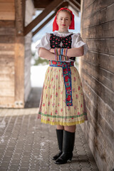 Young beautiful slovak woman in traditional dress. Slovak folklore