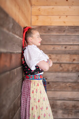 Young beautiful slovak woman in traditional dress. Slovak folklore
