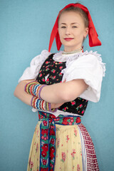 Young beautiful slovak woman in traditional dress. Slovak folklore