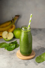 Bottle of green apple and banana smoothie, detox smoothie shake drink