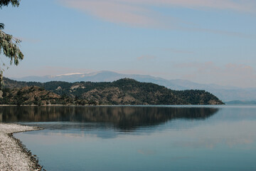 Seaside with a beautiful Mountain View which has a snow on the top of