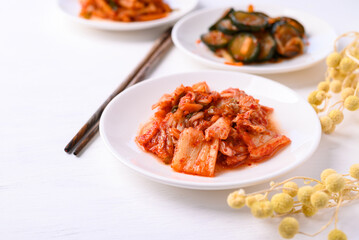 Kimchi cabbage, radish and cucumber  on white background, Korean food homemade side dish