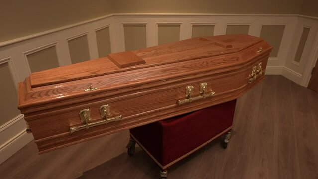 Wooden coffin, funeral and mourning concept. Indoors shot