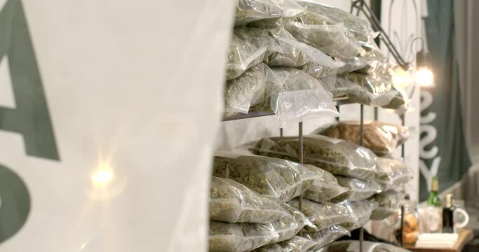 Lots of cannabis bags on the shelf. Attracting a customer to a product. Transportation and storage of plastic bags. 