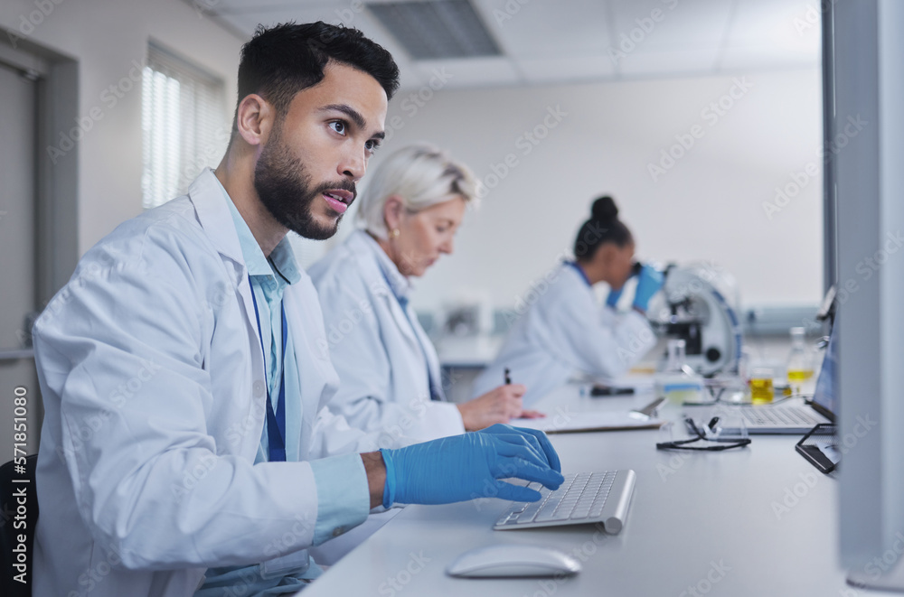 Poster Typing, focus scientist working on computer in lab for medical search, innovation or science study in hospital. Medicine, internet or group of doctors on tech for healthcare or wellness DNA research