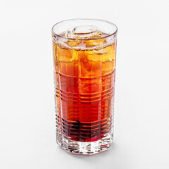 One glass of cold cola, cocktail or cold brew coffee with ice on a white background.