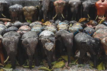 Many elephants statues.  The wood army of souvenir elephants.