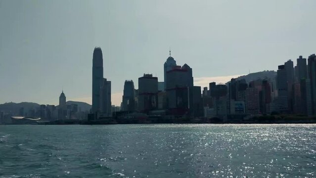 Hong Kong island skyline during the day, view from boat on Victoria Harbor