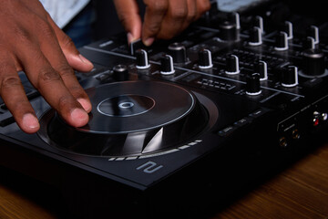 DJ console or mixer is used to combine different audio sources into one output. Talented...
