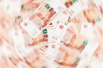 Russian ruble banknotes in blurred motion as a background