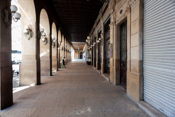 Arched colonnade by the historic Plaza del Castillo square in Old Town, Pamplona