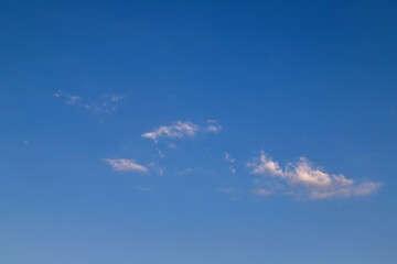 Blue clear sky, few clouds. Blue sky with a few clouds background.