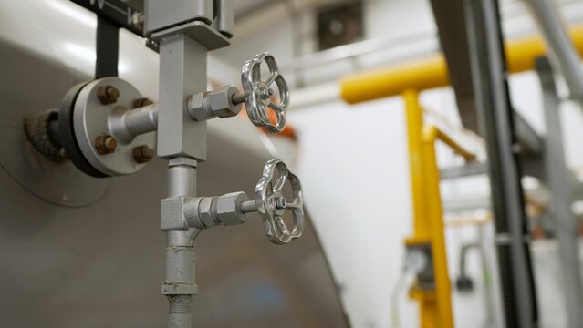 Faucet For Water Supply In A Modern Boiler Room. Heating Circulation Pumps In Commercial Buildings, Industrial Processes And Water Supply. Faucet In The Boiler Room.